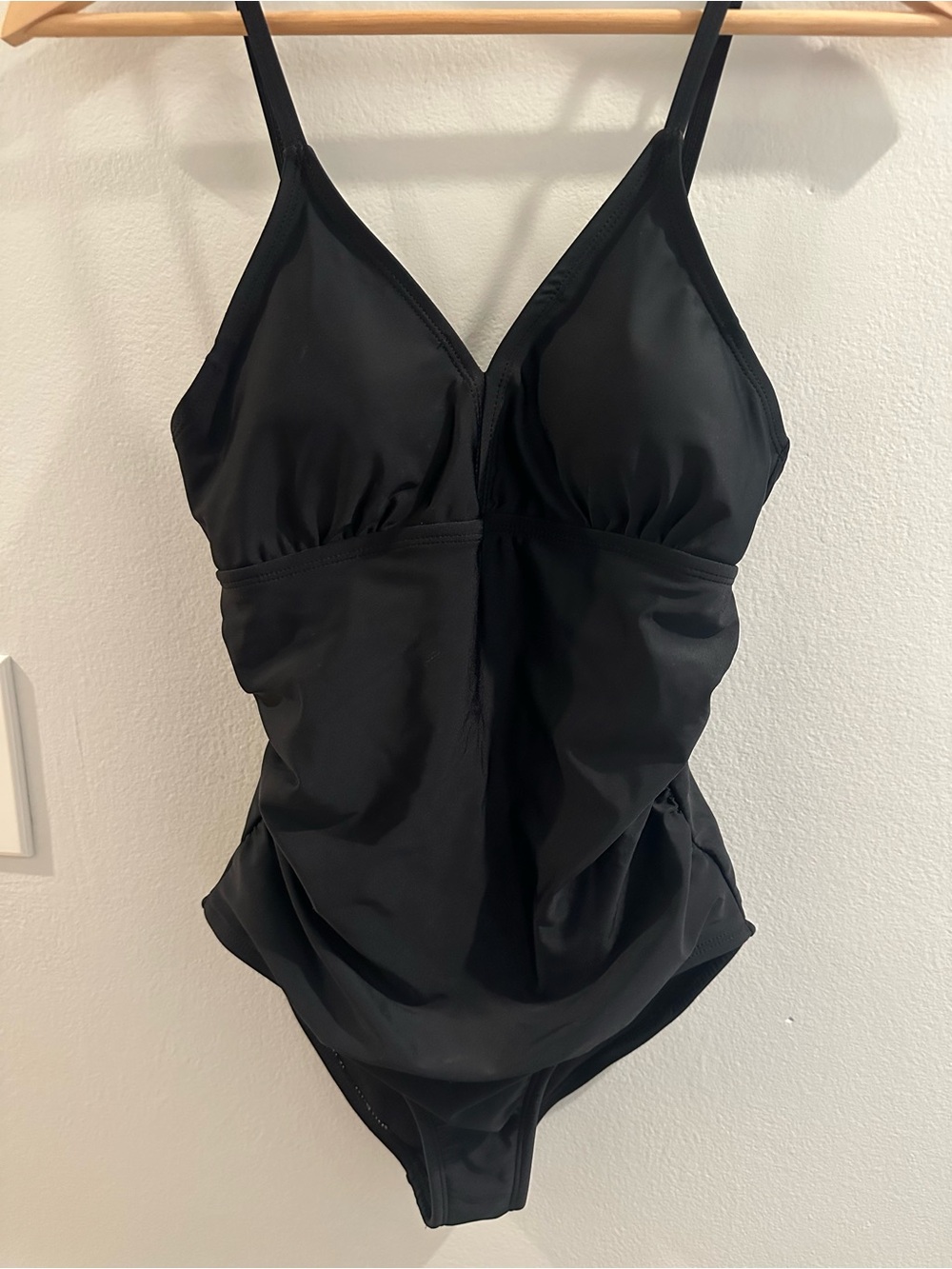 Sleek Modern Black ruched figure flattering contouring one piece swimsuit